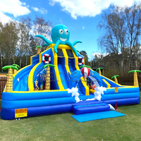 Château gonflable robuste en PVC avec deux toboggans et piscine à balles, idéal pour les parcs d'attractions et les écoles