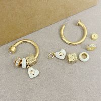 Nouvelles boucles d'oreilles élégantes et tendance, design de niche de luxe léger, pendentif cube en forme de cœur orné de strass, émail glacé