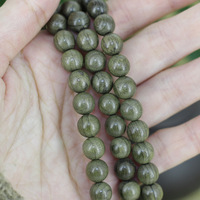 Le fabricant fournit des bracelets de prière en bois d'ébène vert.