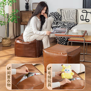 Pouf de rangement pour la maison avec compartiment zippé pour vêtements, jouets et chaussures, design aspect cuir marron - Product Image 1