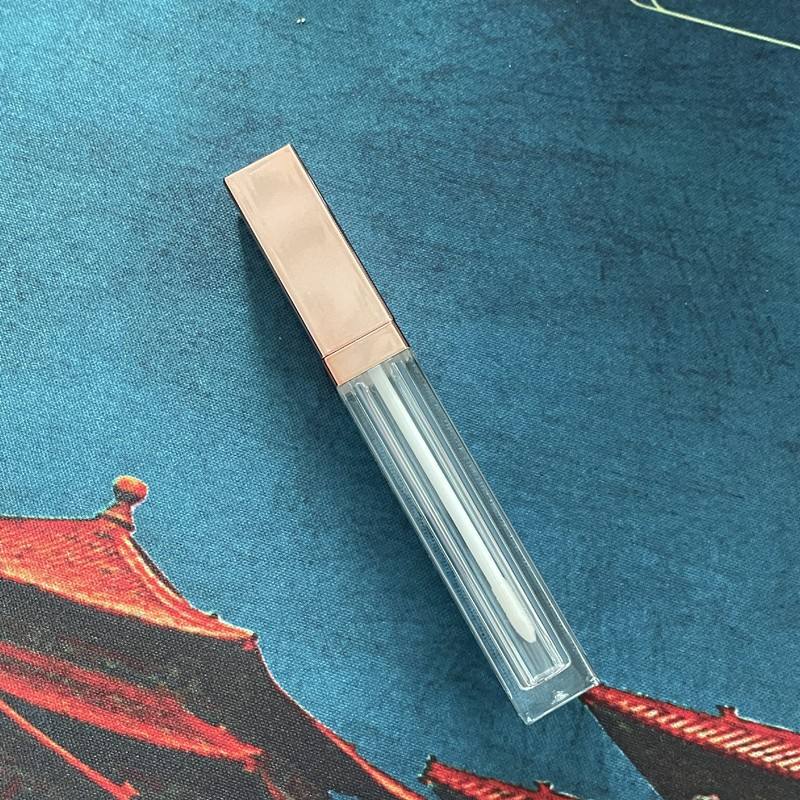 clear tube with shiny rose gold top