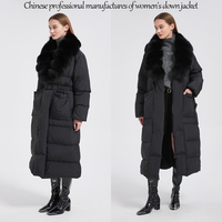 Veste d'hiver longue et brillante noire surdimensionnée coupe-vent pour femmes avec col en fourrure de renard véritable et doublure en duvet d'oie