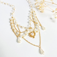 Collier pour femme de style européen et américain, en alliage, avec chaîne en bambou, fausses perles, pompon, cœur, croix, papillon, assorti à tout