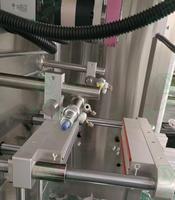 Équipement de remplissage vertical de lait en poudre de structure simple Machine à emballer automatique de lait en poudre de film en rouleau fabricant de petites pochettes alimentaires
