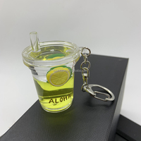 Adorable porte-clés en acrylique transparent rempli d'huile, avec perle flottante pour thé aux bulles, idéal comme souvenir et accessoire de vente au détail