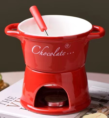 Tasse rouge + fourchette + bougie