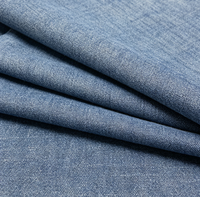 Tissu denim tissé à effet flammé pour vêtements féminins, chemises, jupes et pantalons en coton uni