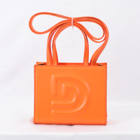 Sacs à main en cuir PU orange avec logo personnalisé en relief, sacs fourre-tout de luxe pour femmes, sacs à main de marque pour femmes fabriqués en usine