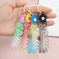Porte-clés en caoutchouc souple PVC, Porte-clés en silicone, Lanière changeante de couleur, Bouteille de sable mouvant, Petit cadeau pendentif