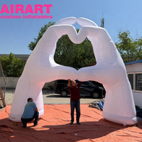 Main gonflable blanche en forme de cœur, arche gonflable en forme de main pour la décoration et l'exposition
