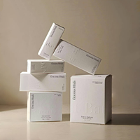 Boîte-cadeau pliante de luxe gaufrage avec logo personnalisé emballage en carton de papier cosmétique à texture spéciale pour bouteilles de parfum boîtes en papier