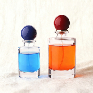 High-end Luxury Custom Logo Cylinder Empty 50ML 100ML Glass Spray <strong>Bottle</strong> with Colored Red and <strong>Blue</strong> Ball Caps - Product Image 1