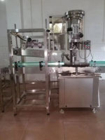 Machine de sertissage automatique de capsules à anneau HL-XGH01 pour les boissons gazeuses, les boissons, la bière, les bouteilles en verre avec un distributeur de capsules