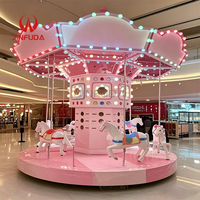 Manège à chevaux carrousel rose et bleu vif avec décorations LED pour enfants et adultes
