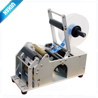 Machine d'étiquetage pour bouteilles rondes semi-automatique