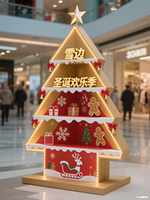 Présentoir en papier sur pied rotatif écologique à 4 niveaux pour la promotion de vacances de jouets de collations de centre commercial sur le thème de Noël