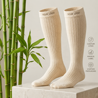 Chaussettes de compression professionnelles en fibre de bambou jacquard, hauteur genou, douces, respirantes, soutien actif, pour logo personnalisé, vente en gros usine