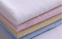 Haute qualité 260gsm blanc bambou Fiber serviette tissu 90% bambou 10% Polyester éponge tricot tissu pour bébé drap de lit