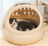 Lit rond pour chat portable et innovant avec coussin amovible lavable et poignée de transport confortable pour les voyages en intérieur et en extérieur