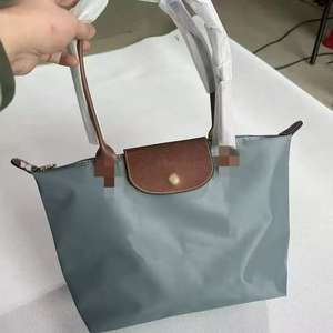 Bolso de Mujer de Diseño Nuevo y Popular 2026, Bolso Tipo Cubo Pequeño, Versátil, de Moda <span class=keywords><strong>Long</strong></span>-xiang, Simple, de Mano y de Hombro, de Poliéster - Product Image 1