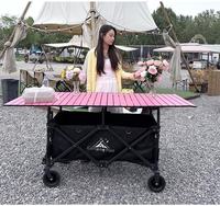 Chariot de camping pliable d'extérieur avec grande table métallique, roues tout-terrain et rangement intégré