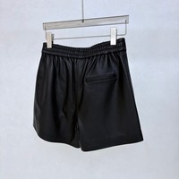 Shorts en cuir classiques pour femmes avec boutons pression, poches latérales, taille élastique au dos, style décontracté urbain pour tous les jours