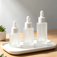Flacon d'essence liquide de 30 ml, flacon cylindrique à épaule plate, flacon liquide en verre de 20 ml, huiles essentielles emballées, flacons vides.