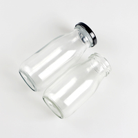 Bouteilles en verre de forme ronde de 250ml vides avec couvercle en métal pour boissons au lait, café, thé et eau