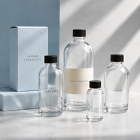 Vente en gros de flacons pompe en verre transparent Boston Round de 250 ml et 500 ml pour les marques privées de savon liquide et de gel lavant pour les mains