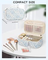 Petite trousse de maquillage florale portable à double compartiment avec espace pour pinceaux, idéale pour les voyages et les articles de toilette