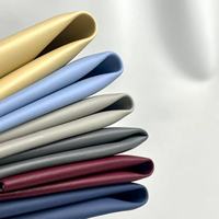 Tissu PVC élastique en gros avec support tricoté et motif gaufré pour revêtement de chaise, sac, voiture, textile de maison, doublure de canapé, vêtement