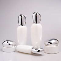 Ensemble d'emballages cosmétiques personnalisés et créatifs en verre pour soins de la peau, flacon de lotion, pot d'essence et de crème avec couvercle nuage imprimé sérigraphié