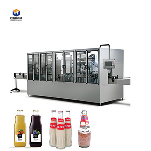 آلة تعبئة وتغطية أوتوماتيكية 3 في 1 للزجاجات البلاستيكية والزجاجية لتعبئة المياه الغازية والقلوية والمعدنية النقية - Product Image 5