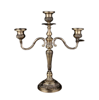 Grande pièce maîtresse de table élégante en candélabre royal en métal pour mariages et événements de fête