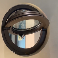 Fenêtres à persiennes ovales modernes en aluminium avec formes personnalisées et ouverture pivotante centrale pour villas, hôtels et vérandas extérieures