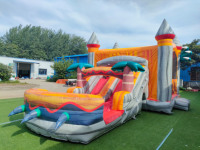 Château gonflable commercial à thème volcan avec toboggan pour location de fêtes d'enfants