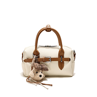 Mini sac Boston cylindrique pour femme en cuir végétalien motif litchi, sac à bandoulière avec breloque chiot, fermeture éclair à sangle unique