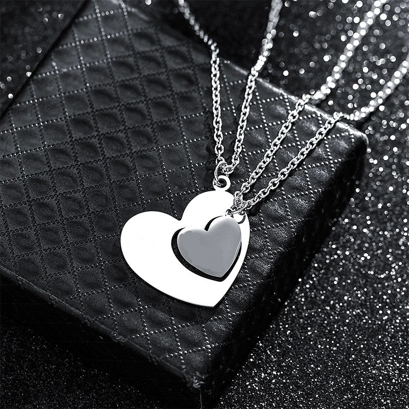 Silver A pair of blank heart necklaces