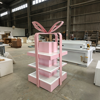 Edgy Luxe Cosmetics Boutique Featuring Tiered Open Shelves, Partial Enclosure Checkout, and Integrated LED Display Shelves