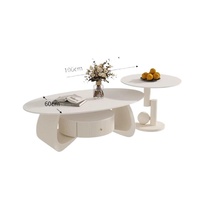 Table basse ovale en marbre style crème avec structure en métal pour salon, petit appartement, mobilier de salon simple et moderne