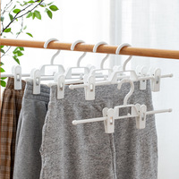 Porte-pantalons multifonctionnel et durable à plusieurs niveaux avec pinces en métal et plastique pour le rangement de sous-vêtements, jupes et pantalons