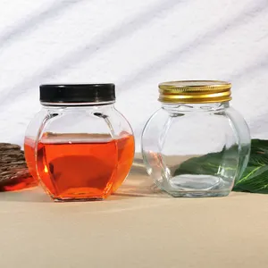 Commercio all'ingrosso 500g 380ml di salsa di vetro contenitore di miele vuoto a forma di esagono vasetti di vetro con vite d'oro tappo di metallo