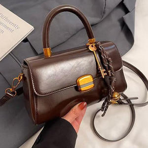 PU Leather Handbag with <b>Strap</b> <b>Buckle</b> and Metal Clasp Shoulder and Crossbody Design - Product Image 5