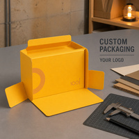Caja de regalo plegable amarilla con diseño impreso y asa superior para regalos minoristas, embalaje de marca, exhibición premium y suministro.