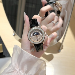 Montre pour femme neuve, quartz, alliage, style charme, soleil, lune, ciel étoilé, diamant, best-seller transfrontalier, CRISTAL SAPHIR - Product Image 1