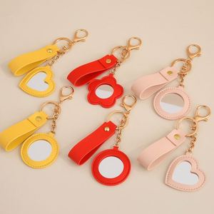 Mini Espejo Creativo en Forma de Corazón, Espejo Redondo con Diseño Floral, Llavero de Cuero PU Antipérdida, Espejo de Maquillaje para Accesorios de Bolsa - Product Image 1