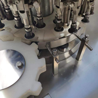 Machine de remplissage et de bouchage automatique pour flacons d'huile, de parfum et de sirop