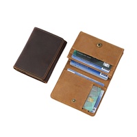 Organisateur de cartes de visite en cuir grainé tactile, design pliable sécurisé avec texture claire pour une identification professionnelle de la marque