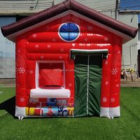 Maison de Noël gonflable personnalisée commerciale de sortie d'usine maison de la grotte du père noël avec lumière led pour la décoration de fête