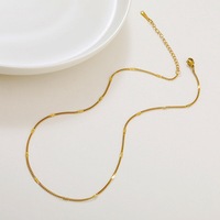 Collier ras du cou unisexe tendance en acier inoxydable avec chaîne serpent, croix latérale et forme O, bijoux
